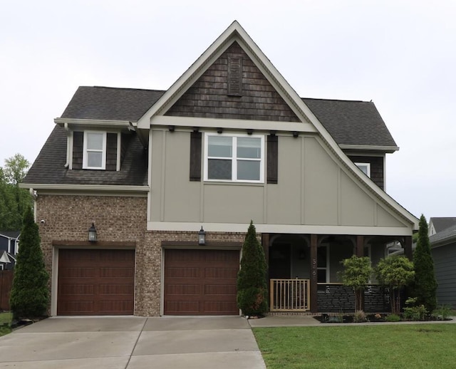 craftsman inspired home with covered porch, driveway, and roof with shingles