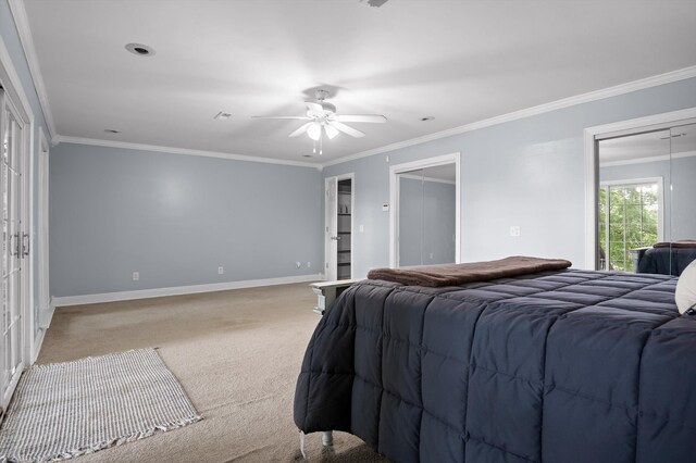 15033 Log Cabin Ln, Soddy Daisy, TN 37379 - carpeted bedroom featuring baseboards, ornamental molding, a ceiling fan, and two closets