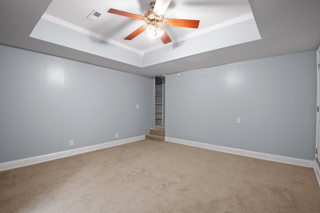 15033 Log Cabin Ln, Soddy Daisy, TN 37379 - spare room featuring crown molding, carpet, ceiling fan, baseboards, and a tray ceiling