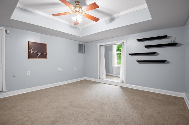 15033 Log Cabin Ln, Soddy Daisy, TN 37379 - unfurnished living room with ornamental molding, carpet, baseboards, a ceiling fan, and a tray ceiling