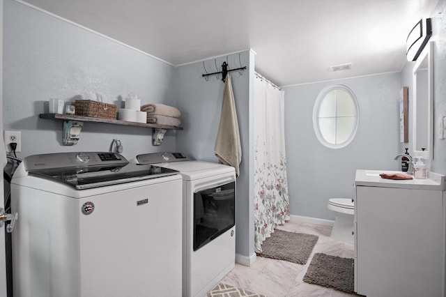 15033 Log Cabin Ln, Soddy Daisy, TN 37379 - laundry room featuring washing machine and clothes dryer, light marble finish flooring, baseboards, and ornamental molding