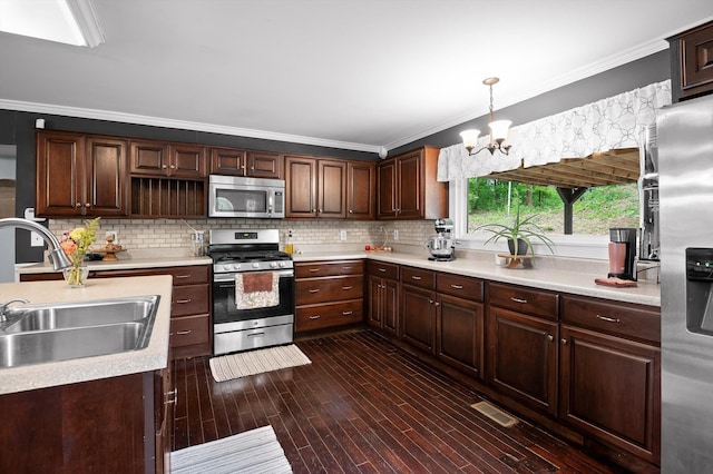 15033 Log Cabin Ln, Soddy Daisy, TN 37379 - kitchen with stainless steel appliances, a sink, a chandelier, ornamental molding, and light countertops