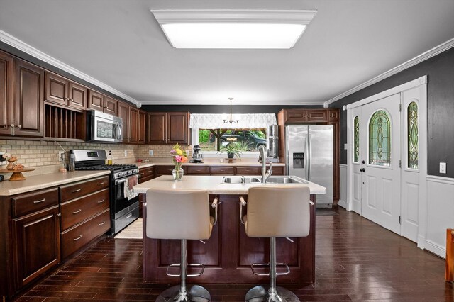 15033 Log Cabin Ln, Soddy Daisy, TN 37379 - kitchen featuring stainless steel appliances, light countertops, dark wood-style floors, backsplash, and ornamental molding