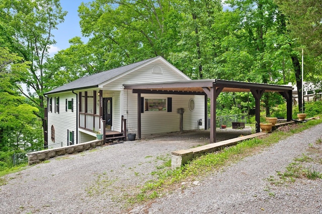 15033 Log Cabin Ln, Soddy Daisy, TN 37379 - view of front of house featuring driveway, covered porch, and an attached carport