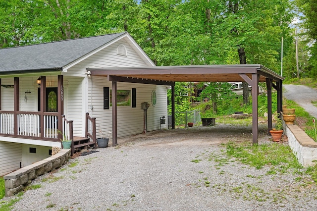 15033 Log Cabin Ln, Soddy Daisy, TN 37379 - view of front of property featuring gravel driveway, a shingled roof, a porch, and an attached carport