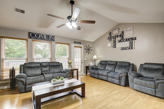 8820 Forest Pond Dr, Harrison, TN 37341 - living room featuring ceiling fan, vaulted ceiling, light wood finished floors, and plenty of natural light