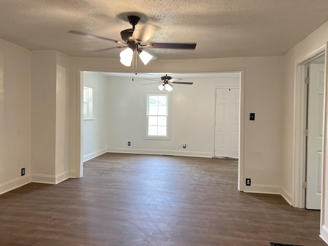 560 8th St NE, Cleveland, TN 37311 - empty room featuring ceiling fan, a textured ceiling, dark wood-style flooring, and baseboards
