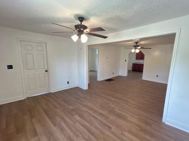 560 8th St NE, Cleveland, TN 37311 - unfurnished room with ceiling fan, wood finished floors, baseboards, and a textured ceiling