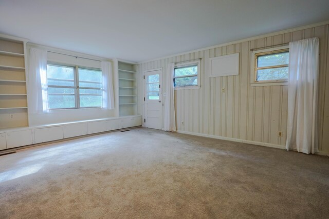 3703 Chula Vista Dr, Chattanooga, TN 37411 - spare room with carpet flooring, healthy amount of natural light, built in shelves, and crown molding