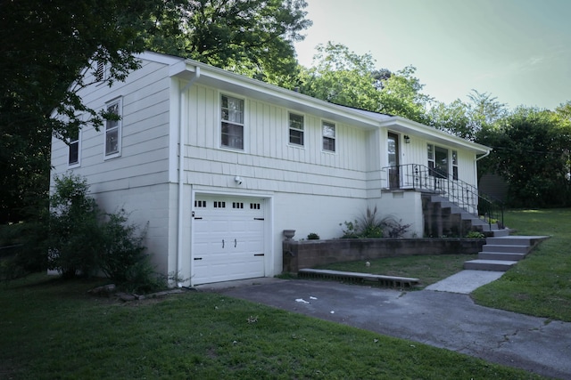 3703 Chula Vista Dr, Chattanooga, TN 37411 - single story home with an attached garage, a front lawn, concrete driveway, and board and batten siding