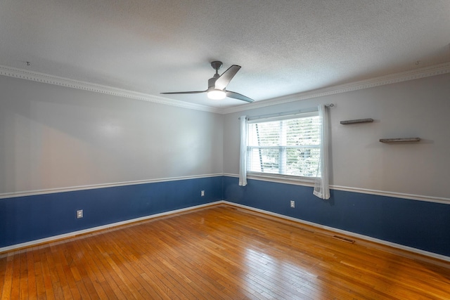 7429 Irongate Dr, Hixson, TN 37343 - spare room with hardwood / wood-style flooring, ornamental molding, a ceiling fan, a textured ceiling, and baseboards