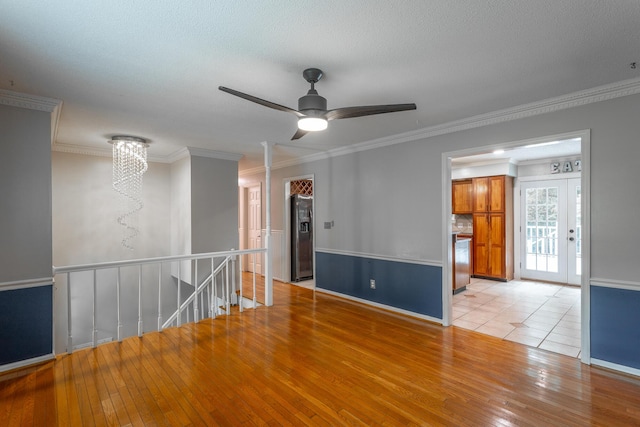 7429 Irongate Dr, Hixson, TN 37343 - unfurnished room featuring a chandelier, hardwood / wood-style floors, ornamental molding, ceiling fan, and baseboards