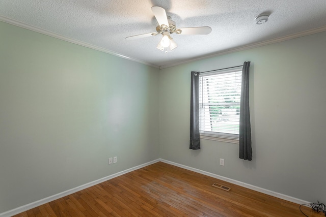 7429 Irongate Dr, Hixson, TN 37343 - spare room featuring wood-type flooring, a ceiling fan, crown molding, baseboards, and a textured ceiling