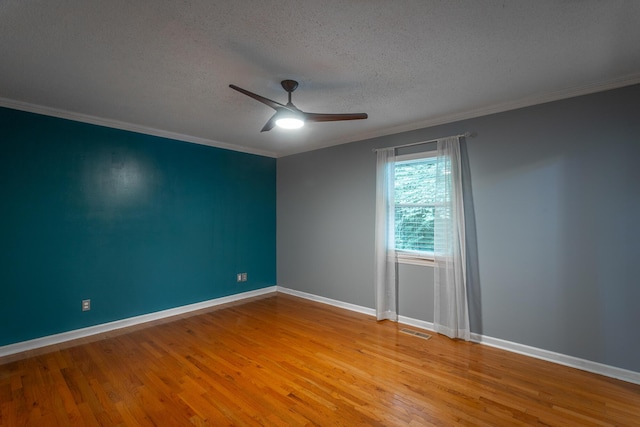 7429 Irongate Dr, Hixson, TN 37343 - unfurnished room featuring a textured ceiling, light wood-type flooring, a ceiling fan, crown molding, and baseboards