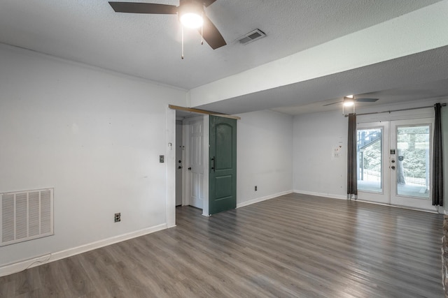 7429 Irongate Dr, Hixson, TN 37343 - empty room with a ceiling fan, wood finished floors, baseboards, french doors, and a textured ceiling