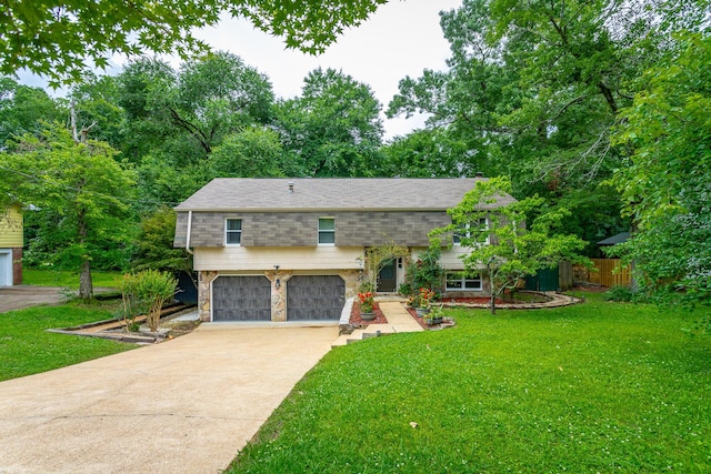 7429 Irongate Dr, Hixson, TN 37343 - raised ranch featuring driveway, a garage, and a shingled roof