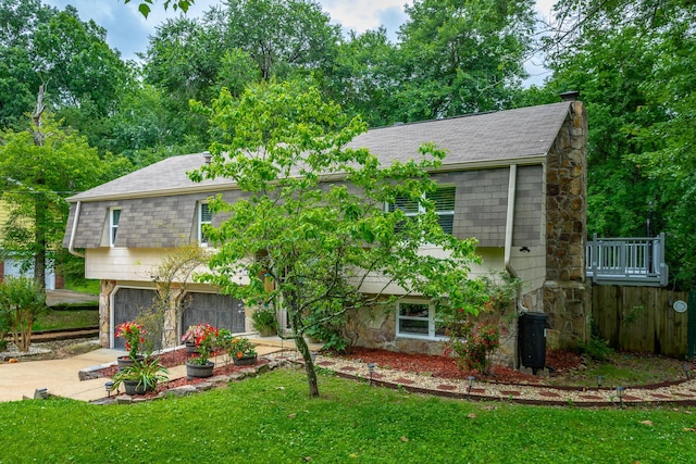 7429 Irongate Dr, Hixson, TN 37343 - view of front of home featuring stone siding, concrete driveway, roof with shingles, and a garage