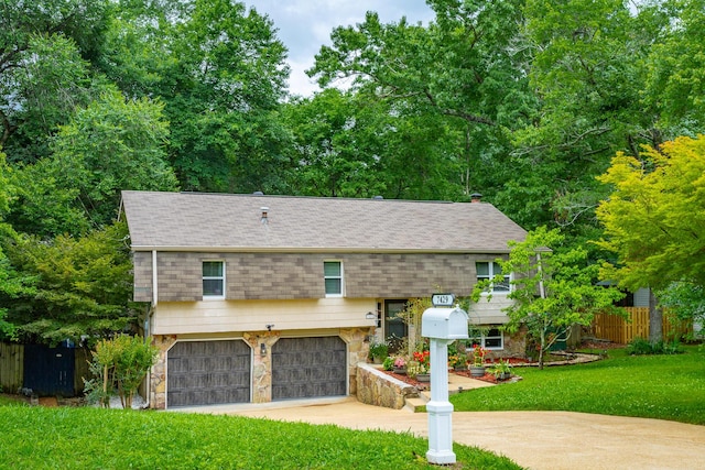 7429 Irongate Dr, Hixson, TN 37343 - view of front facade featuring stone siding, an attached garage, and a shingled roof