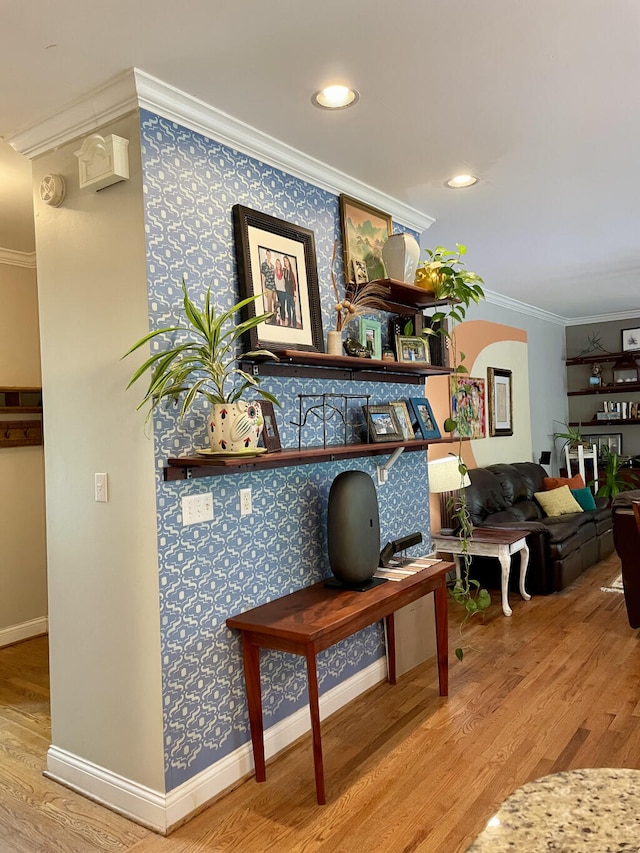 detailed view of ornamental molding, wood finished floors, baseboards, and arched walkways