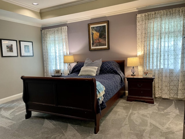 bedroom with carpet floors, ornamental molding, a tray ceiling, baseboards, and recessed lighting