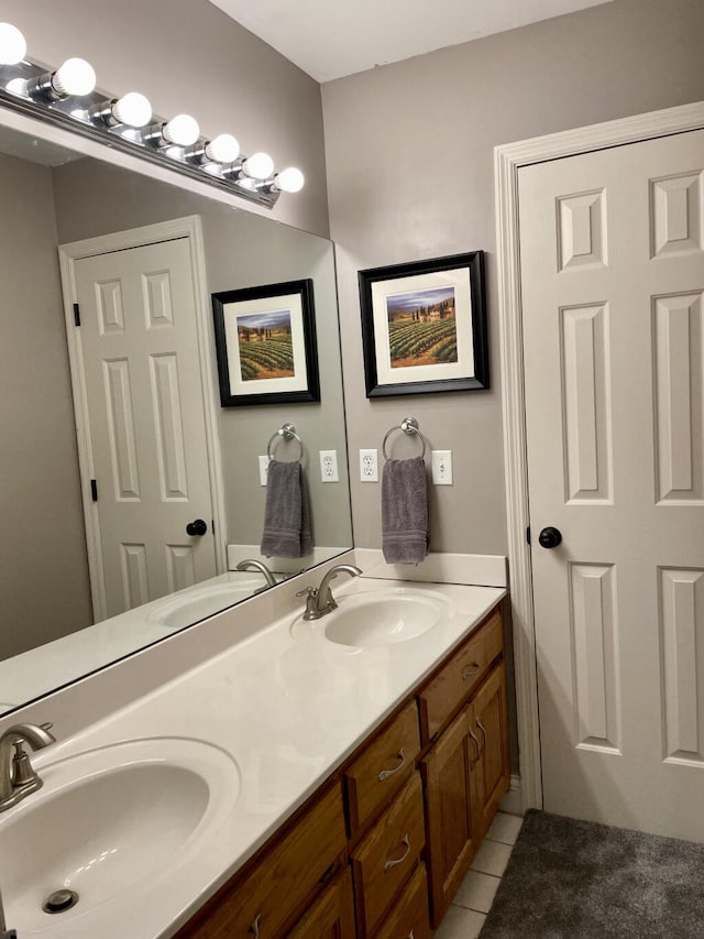 full bathroom with tile patterned flooring and double vanity