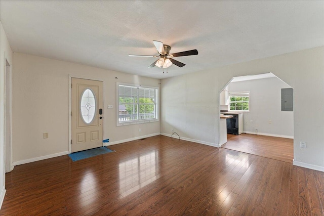 entryway featuring plenty of natural light, a ceiling fan, electric panel, and wood finished floors