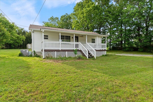 view of front of house with covered porch and a front yard