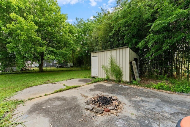 view of shed with a fire pit