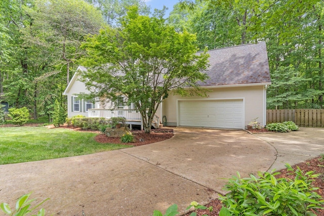 1623 Devlan Forest Ln, Signal Mountain, TN 37377 - view of front of house featuring concrete driveway, a garage, a shingled roof, and covered porch