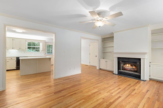 1623 Devlan Forest Ln, Signal Mountain, TN 37377 - unfurnished living room with light wood finished floors, a fireplace with flush hearth, ornamental molding, built in shelves, and ceiling fan