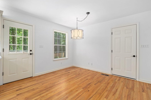 1623 Devlan Forest Ln, Signal Mountain, TN 37377 - unfurnished dining area with light wood-style flooring and a chandelier