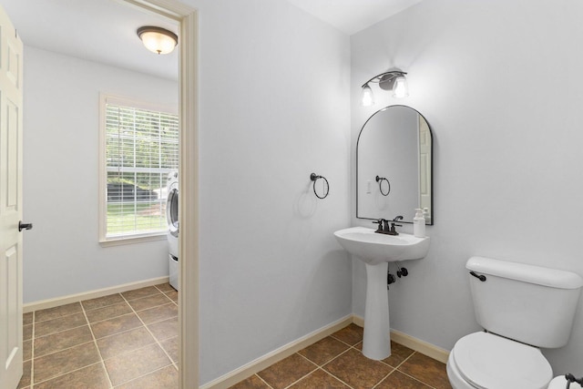 1623 Devlan Forest Ln, Signal Mountain, TN 37377 - bathroom with plenty of natural light, tile patterned floors, and washer / dryer