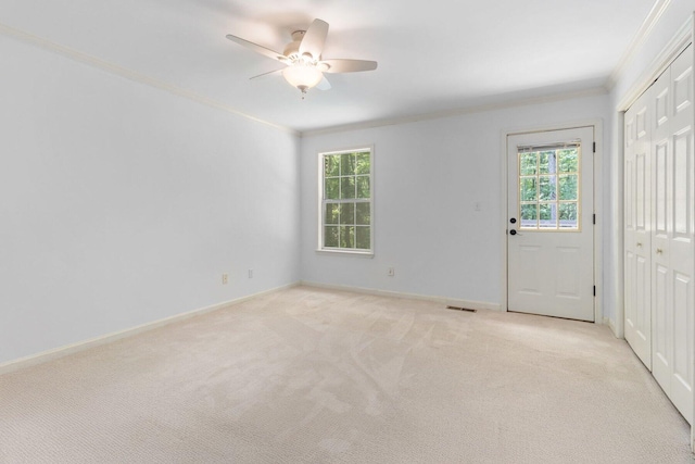 1623 Devlan Forest Ln, Signal Mountain, TN 37377 - foyer featuring ornamental molding, plenty of natural light, light carpet, and a ceiling fan