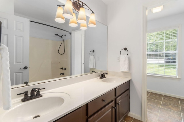 1623 Devlan Forest Ln, Signal Mountain, TN 37377 - full bathroom with healthy amount of natural light, double vanity, tile patterned floors, and tub / shower combination