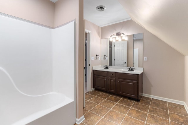 1623 Devlan Forest Ln, Signal Mountain, TN 37377 - bathroom featuring double vanity, vaulted ceiling, and tile patterned flooring