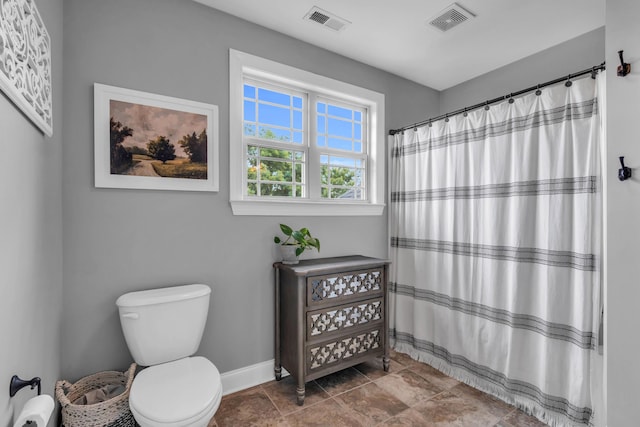 7983 Chianti Way, Chattanooga, TN 37421 - full bathroom featuring toilet, baseboards, and a shower with shower curtain