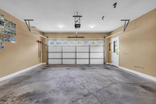 7983 Chianti Way, Chattanooga, TN 37421 - garage with baseboards and a garage door opener