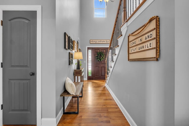 7983 Chianti Way, Chattanooga, TN 37421 - entrance foyer featuring stairway, wood finished floors, baseboards, healthy amount of natural light, and a towering ceiling