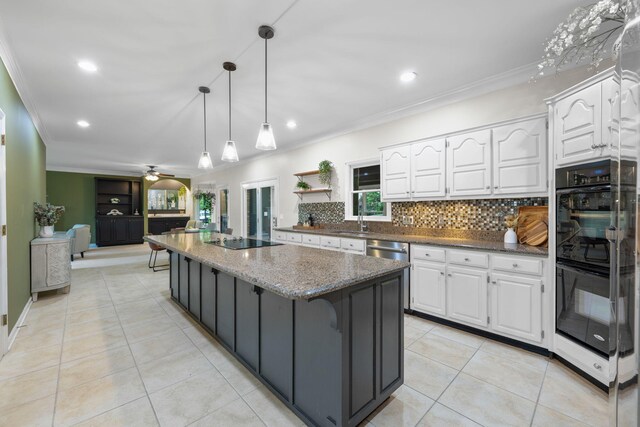 9416 Royal Mountain Dr, Chattanooga, TN 37421 - kitchen featuring black appliances, ornamental molding, white cabinets, a center island, and decorative backsplash