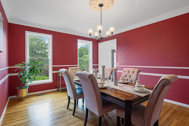 9416 Royal Mountain Dr, Chattanooga, TN 37421 - dining room with a chandelier, baseboards, wood finished floors, and crown molding