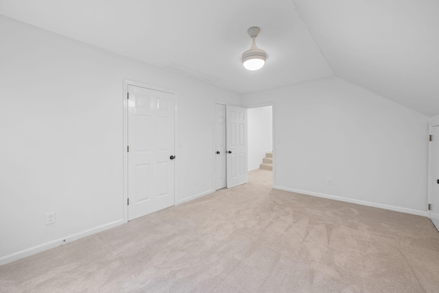 9416 Royal Mountain Dr, Chattanooga, TN 37421 - additional living space with vaulted ceiling, light colored carpet, and baseboards