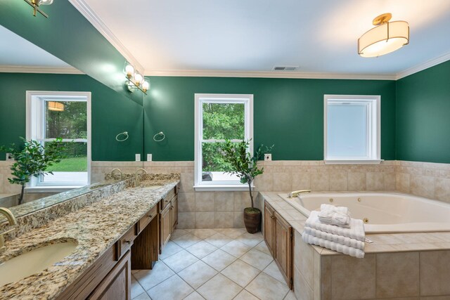 9416 Royal Mountain Dr, Chattanooga, TN 37421 - bathroom with tile patterned floors, tile walls, double vanity, a jetted tub, and crown molding