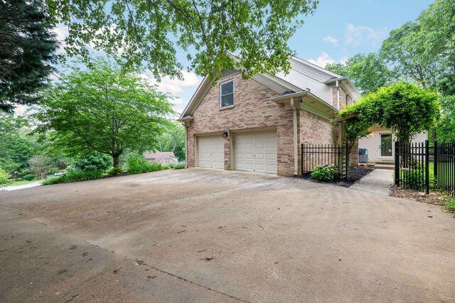 9416 Royal Mountain Dr, Chattanooga, TN 37421 - view of front facade with fence, brick siding, and driveway