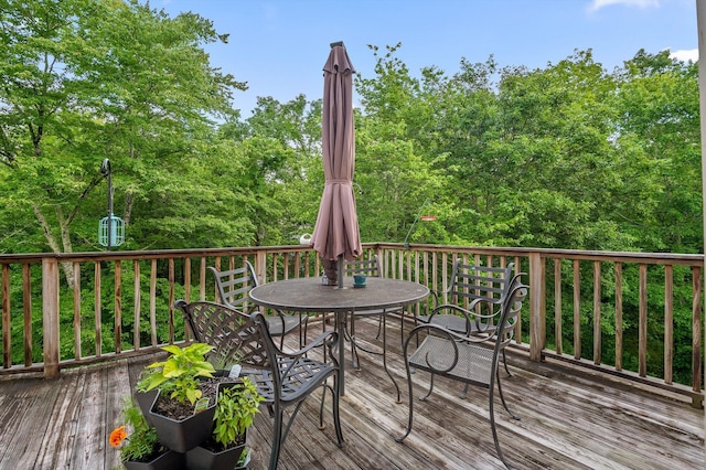 wooden deck with outdoor dining area