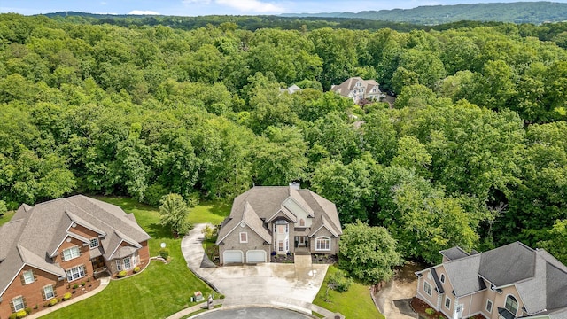 view of subject property featuring a forest