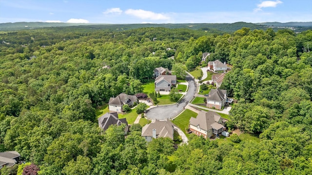 aerial view of residential area featuring a heavily wooded area