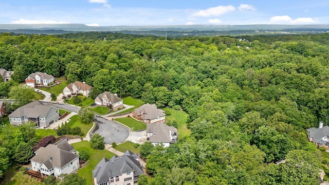 aerial view of residential area featuring a heavily wooded area