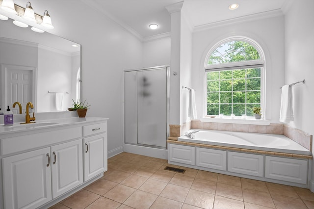 full bathroom featuring crown molding, vanity, tile patterned floors, a shower stall, and a garden tub
