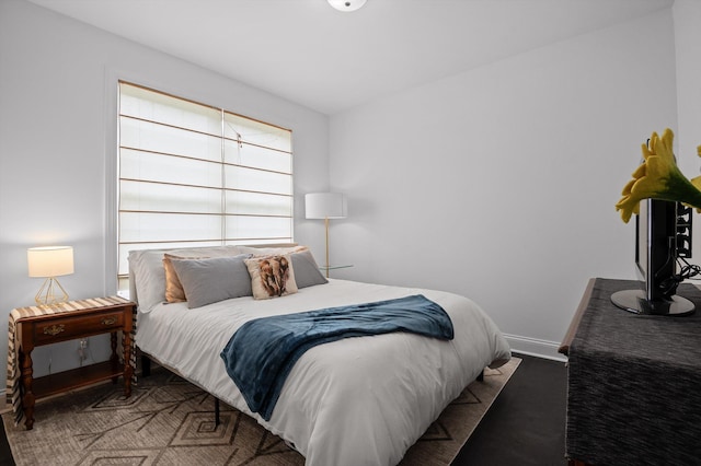 bedroom featuring baseboards