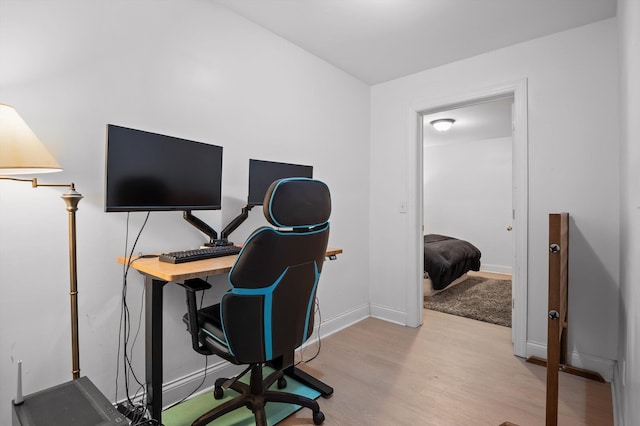 office area with wood finished floors and baseboards